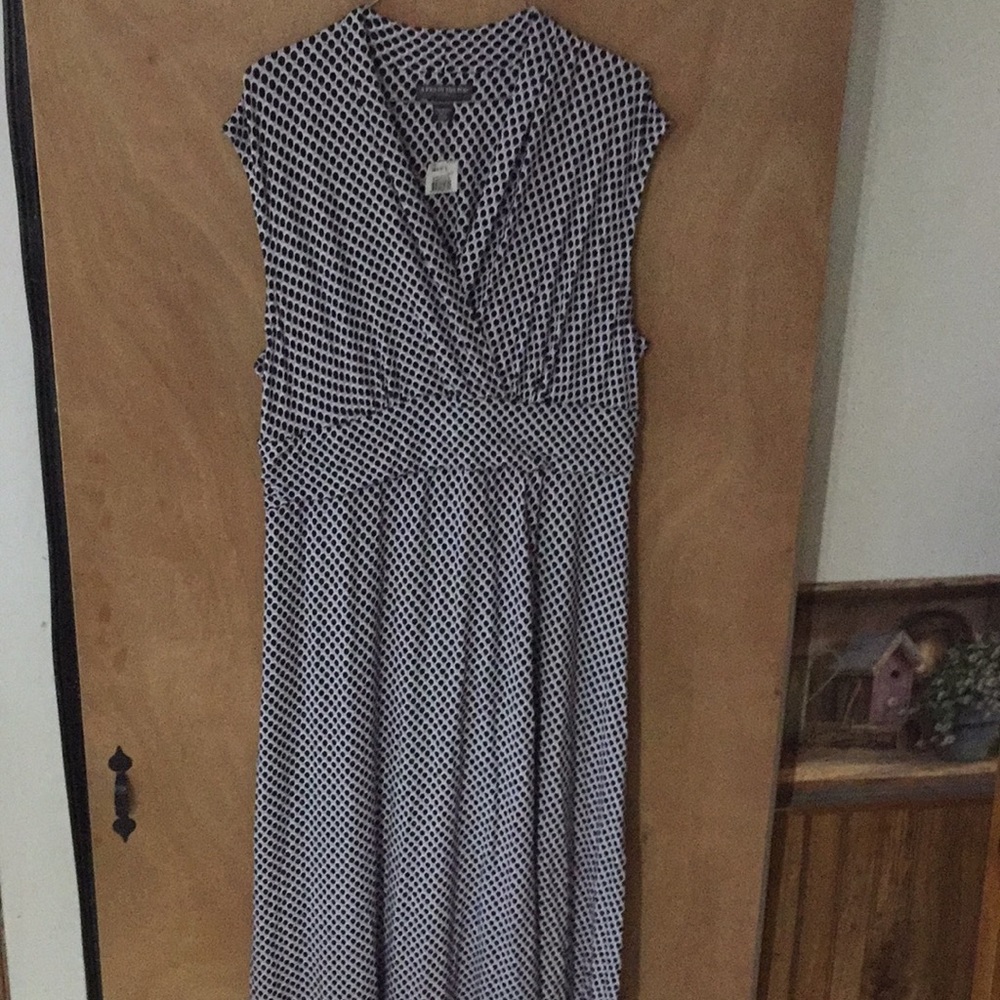 Sleeveless purple and black polka dotted dress